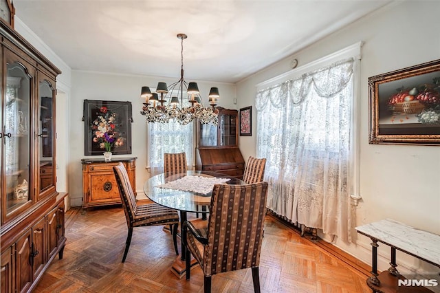dining space featuring an inviting chandelier and ornamental molding