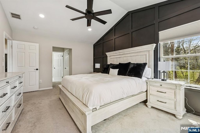 bedroom featuring visible vents, recessed lighting, vaulted ceiling, and light carpet