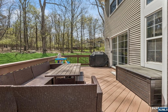deck with an outdoor living space and grilling area