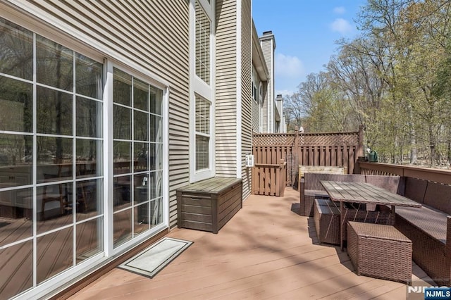 wooden deck featuring outdoor dining space