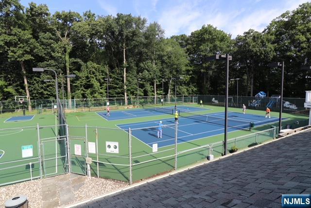 view of sport court featuring fence and community basketball court