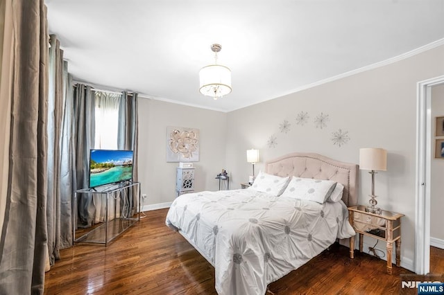 bedroom featuring an inviting chandelier, baseboards, ornamental molding, and wood finished floors