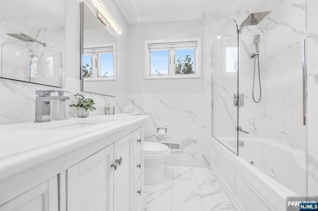 bathroom featuring visible vents, ornamental molding, vanity, toilet, and tile walls