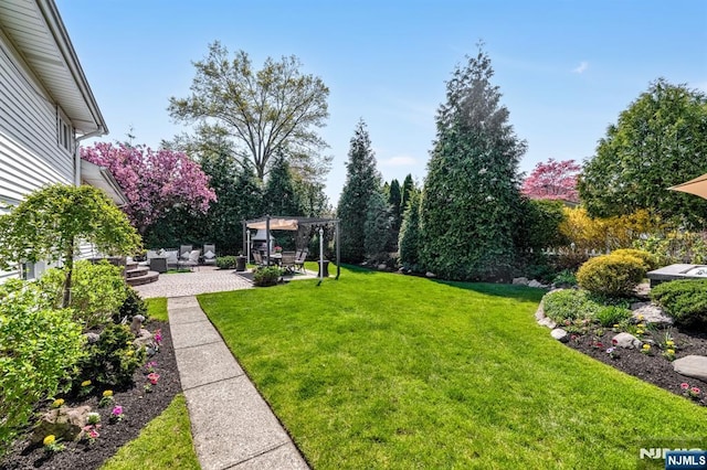 view of yard with a pergola, an outdoor living space, and a patio