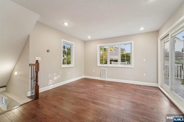 119 Lenox Ave, New Milford, NJ 07646 - empty room with a healthy amount of sunlight, baseboards, hardwood / wood-style floors, and visible vents