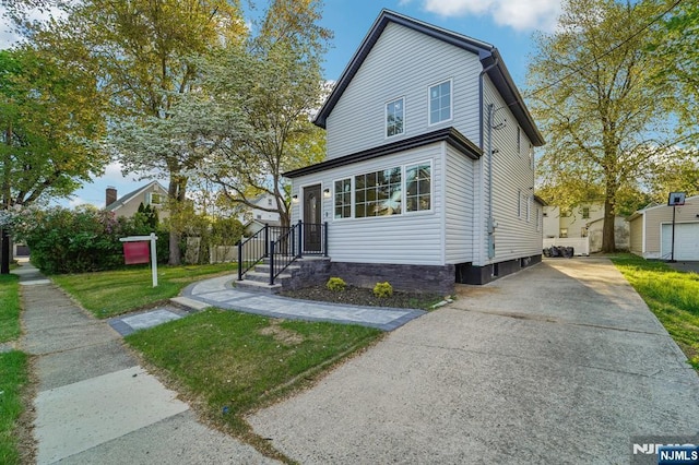 119 Lenox Ave, New Milford, NJ 07646 - traditional-style house featuring an outbuilding, driveway, and a front yard