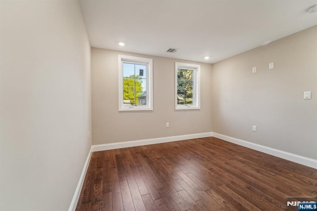 119 Lenox Ave, New Milford, NJ 07646 - spare room featuring dark wood-style flooring, baseboards, visible vents, and recessed lighting