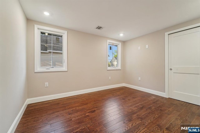 119 Lenox Ave, New Milford, NJ 07646 - empty room featuring recessed lighting, baseboards, visible vents, and dark wood-style floors