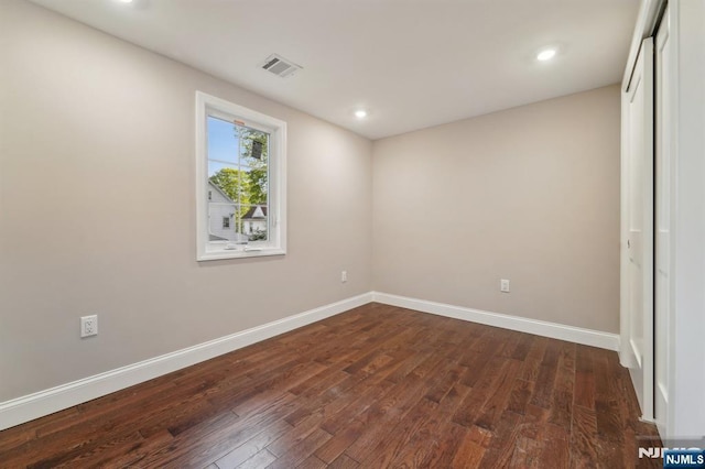 119 Lenox Ave, New Milford, NJ 07646 - unfurnished bedroom featuring visible vents, dark wood-style flooring, baseboards, and a closet