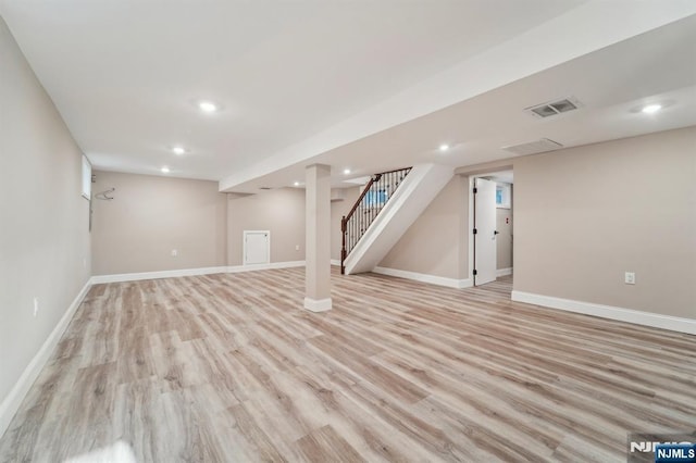119 Lenox Ave, New Milford, NJ 07646 - finished below grade area featuring stairs, baseboards, visible vents, and light wood-style flooring