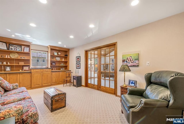 living room with recessed lighting, baseboards, light carpet, and french doors