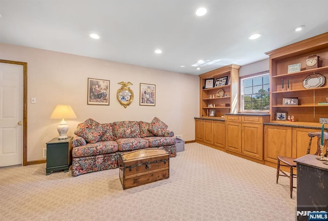 carpeted living room featuring recessed lighting and baseboards