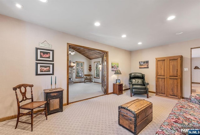 living area featuring baseboards, light carpet, vaulted ceiling, and recessed lighting