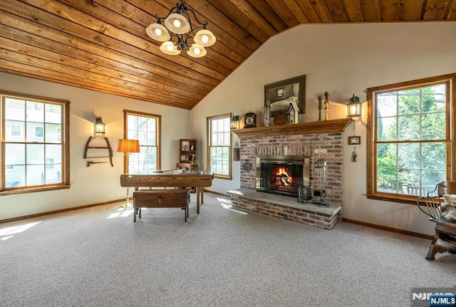 sitting room with baseboards, carpet flooring, a brick fireplace, and wooden ceiling