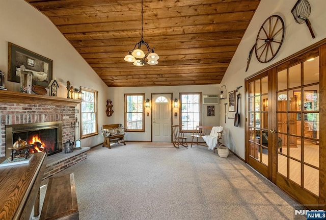 living area with baseboards, high vaulted ceiling, wood ceiling, french doors, and carpet flooring