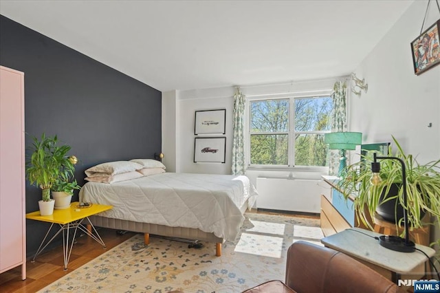 bedroom with wood finished floors