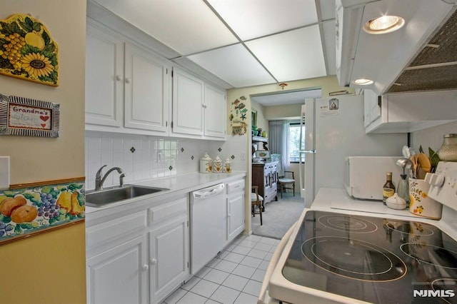 kitchen with white cabinets, a sink, dishwasher, light countertops, and range with electric cooktop