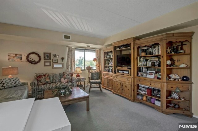 living room featuring carpet flooring and visible vents