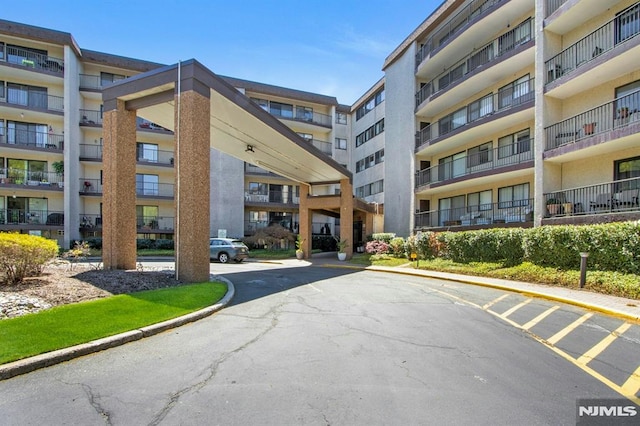 view of property with uncovered parking