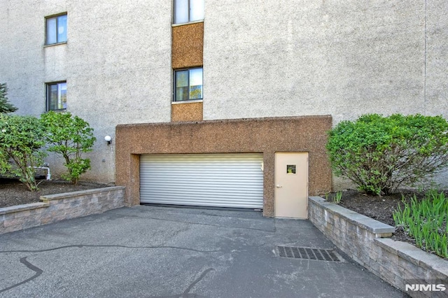 garage featuring driveway