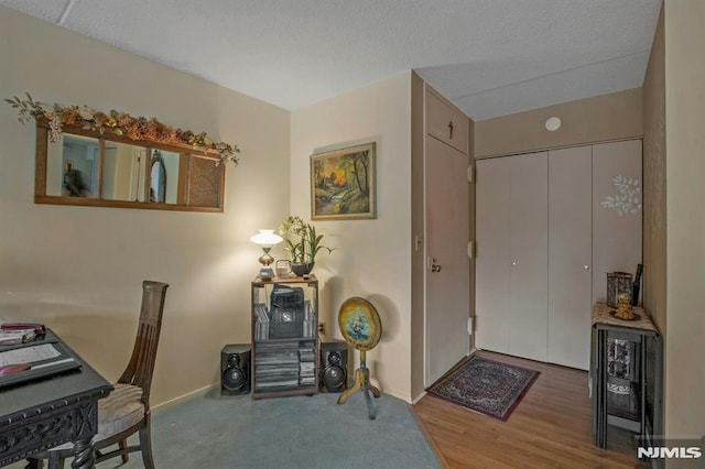 entrance foyer featuring baseboards and wood finished floors