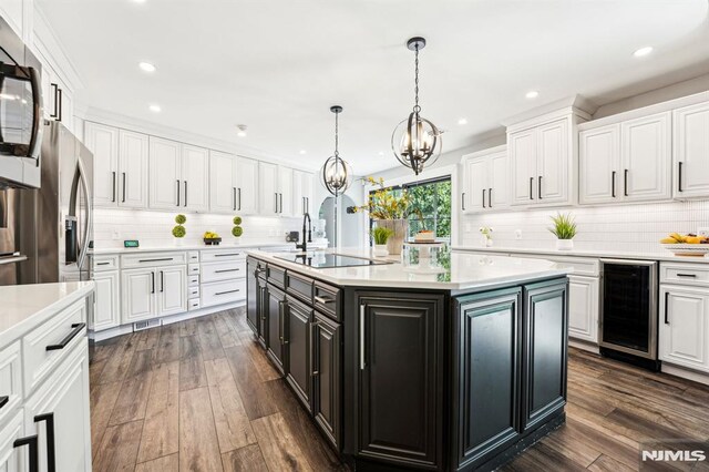 18 Fairview Dr, North Caldwell, NJ 07006 - kitchen featuring wine cooler, white cabinetry, light countertops, and recessed lighting