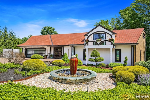 18 Fairview Dr, North Caldwell, NJ 07006 - view of front of property with stucco siding and a garage