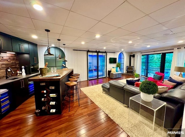 18 Fairview Dr, North Caldwell, NJ 07006 - living room with dark wood-type flooring, wet bar, a drop ceiling, and recessed lighting