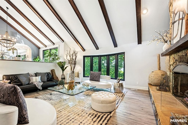 18 Fairview Dr, North Caldwell, NJ 07006 - living room featuring wood finished floors, baseboards, beam ceiling, a chandelier, and a premium fireplace