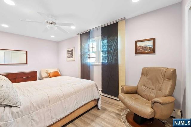bedroom with recessed lighting, a ceiling fan, and light wood finished floors