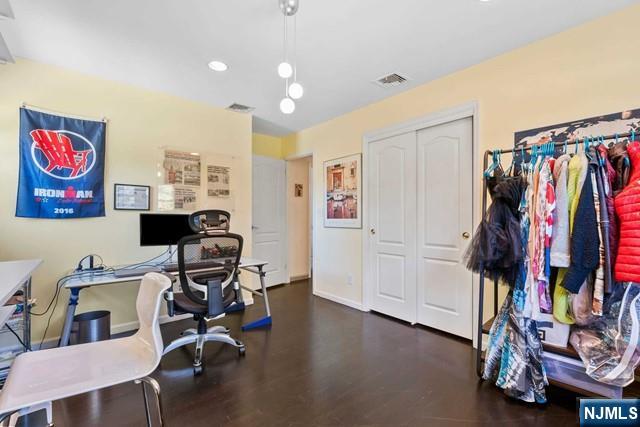 home office featuring visible vents, recessed lighting, baseboards, and wood finished floors