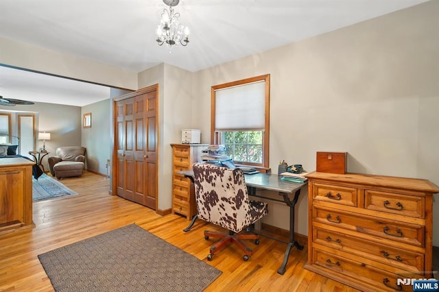 office area featuring light wood-type flooring and baseboards