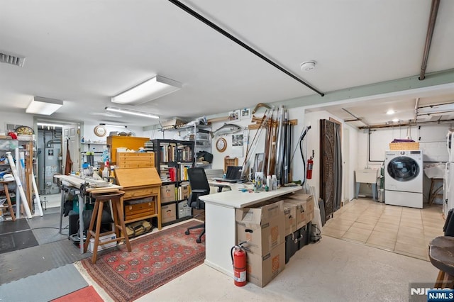 below grade area featuring washer / dryer and visible vents