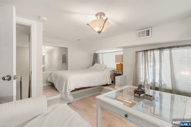 518-536 Gregory Ave Unit C408, Weehawken, NJ 07086 - bedroom with light wood-style flooring and connected bathroom