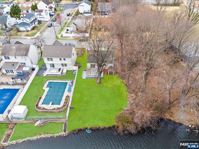 birds eye view of property with a residential view and a water view