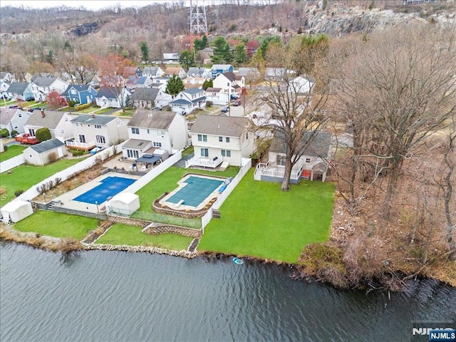 bird's eye view with a residential view and a water view
