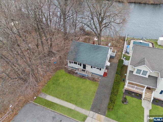 birds eye view of property with a water view