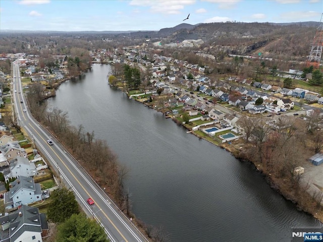 birds eye view of property featuring a water view and a residential view