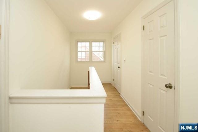 1-06 Lambert Rd, Fair Lawn, NJ 07410 - hall featuring baseboards and light wood-style flooring