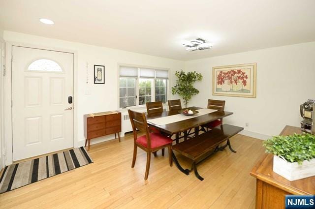 1-06 Lambert Rd, Fair Lawn, NJ 07410 - dining area featuring baseboards, recessed lighting, radiator, and light wood finished floors