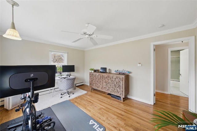 office area with crown molding, ceiling fan, a baseboard radiator, and wood finished floors