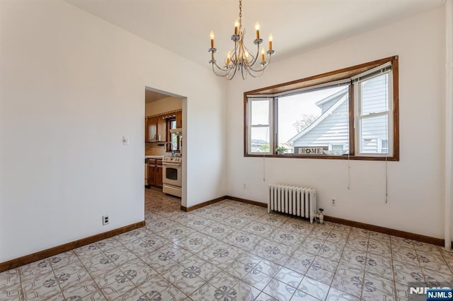 spare room featuring an inviting chandelier, radiator, baseboards, and a wealth of natural light
