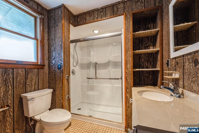 full bathroom with tile patterned flooring, vanity, toilet, and a shower stall