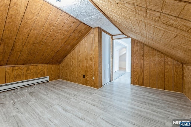 bonus room featuring wood ceiling, wood finished floors, a baseboard radiator, lofted ceiling, and wooden walls