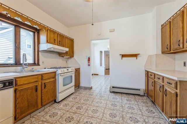kitchen featuring brown cabinetry, a sink, white appliances, under cabinet range hood, and a baseboard radiator