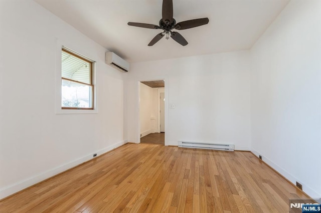 unfurnished room featuring ceiling fan, a wall unit AC, baseboard heating, and light wood-type flooring