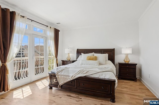 50 Constitution Way Unit 50, Jersey City, NJ 07305 - bedroom with crown molding, access to exterior, and light wood-type flooring