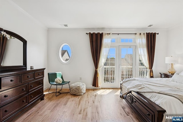 50 Constitution Way Unit 50, Jersey City, NJ 07305 - bedroom with access to outside, crown molding, and light wood-style flooring