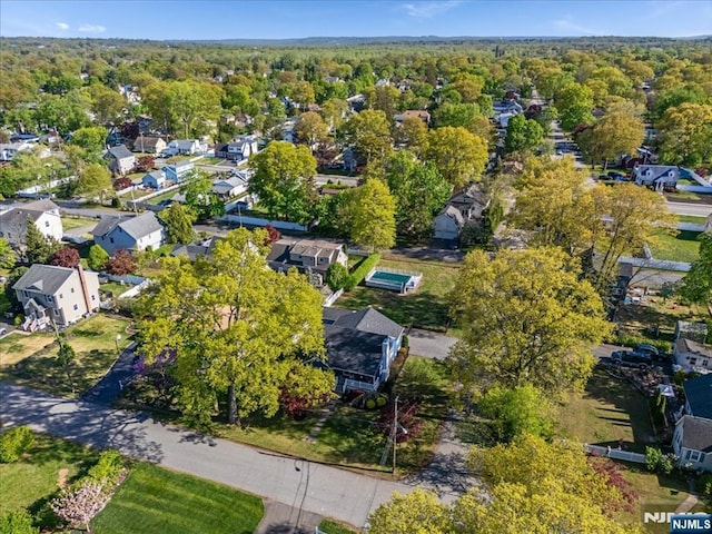 bird's eye view featuring a residential view and a view of trees