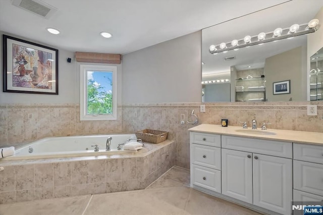 full bath with a shower, vanity, a bath, and visible vents